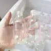 Transparent water bottle with ball and lid