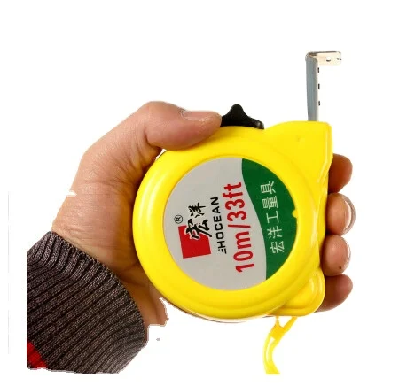De Plannen En Het Meetlint Van De Bouw Stock Foto - Image of eerst