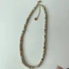 9    Snake-skin pattern flying disc necklace