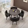 Black leather dining table and four chairs