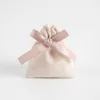 Beige Bag with Pink Ribbon