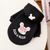 Black dog with hat