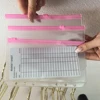 Borsa con cerniera in PVC rosa satinato