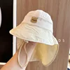 Chal conejito bordado de caqui