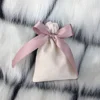 Beige Bag with Pink Ribbon