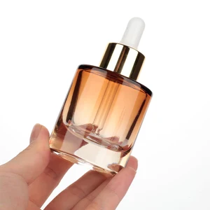 Luxury Cosmetic Packaging 30ml Glass Dropper Bottle Oval Shape Lotion Bottle 30ml with Electroplating Gold Cap
