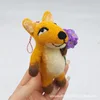 Fox holding purple flowers