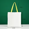 Bolso tote amarillo de 21*23 con asa de lona blanca.