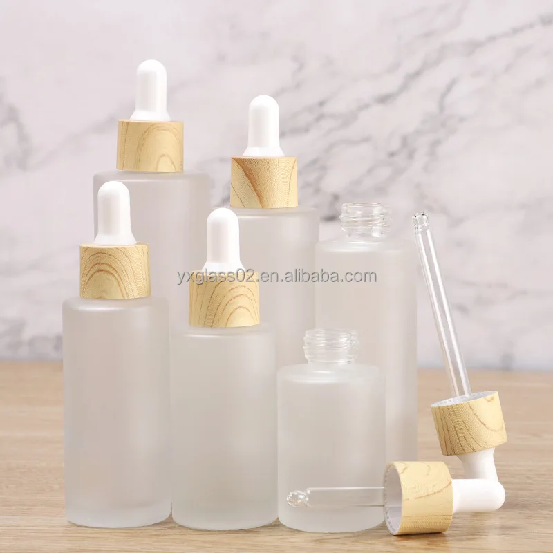 Frosted Essential Oil glass bottle serum glass bottle Flat Shoulder Dropper bottle with Plastic environmentally wood grain ring manufacture