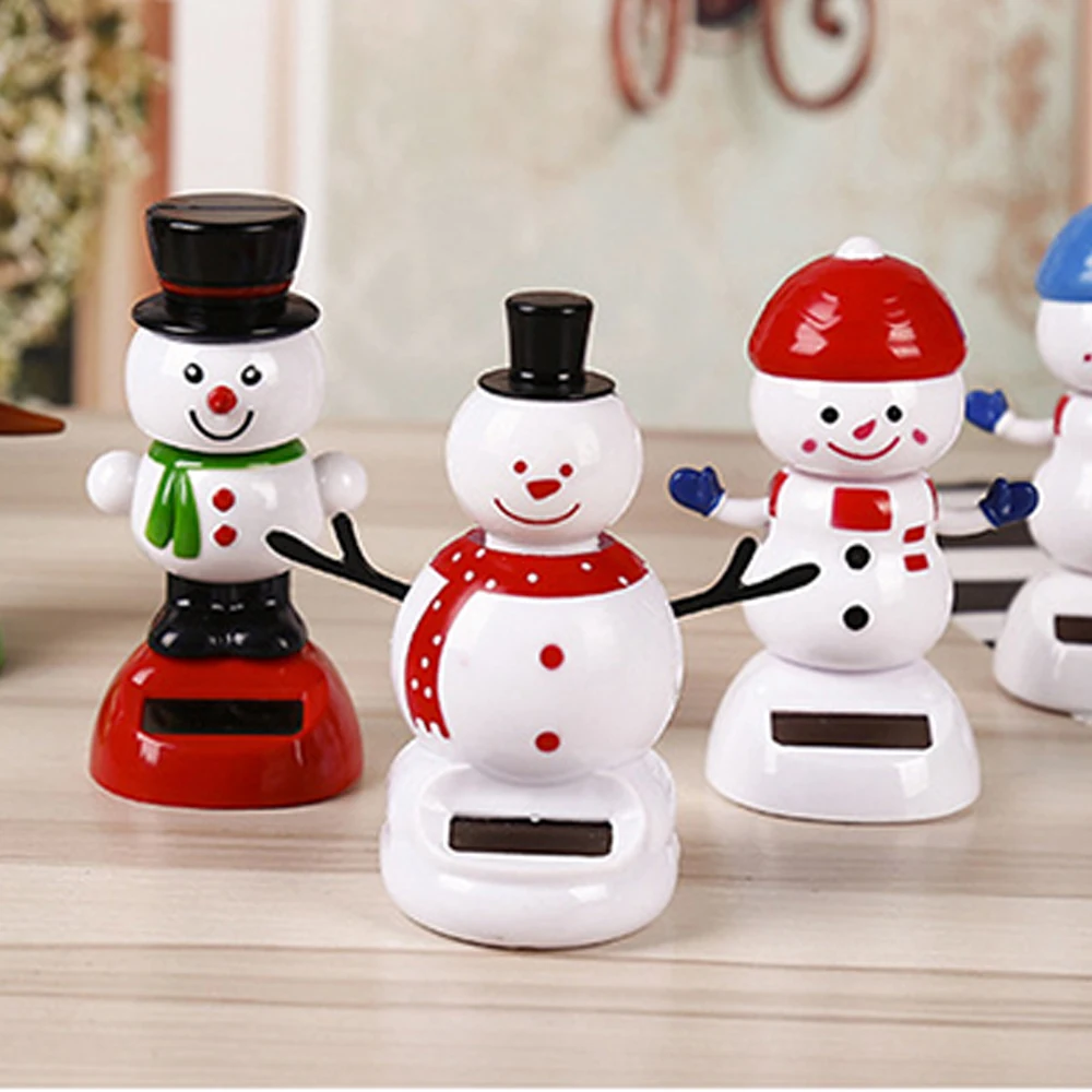 Рождественский танцующий снеговик на солнечной батарее