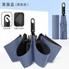 Paraguas negro plegable automático sin anillos, con hebilla azul Haze.