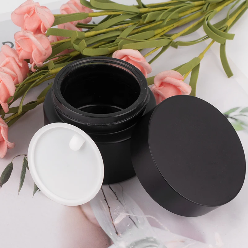 Luxury cosmetic packaging set 50g 40ml 100ml 120ml matte black round cosmetic glass bottle pump lotion bottles factory