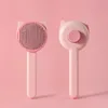 Peine con forma de oreja de gato rosa