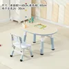 Une table et une chaise de couleur bleu baleine grain de bois.