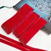 Ruban rouge en velours doré