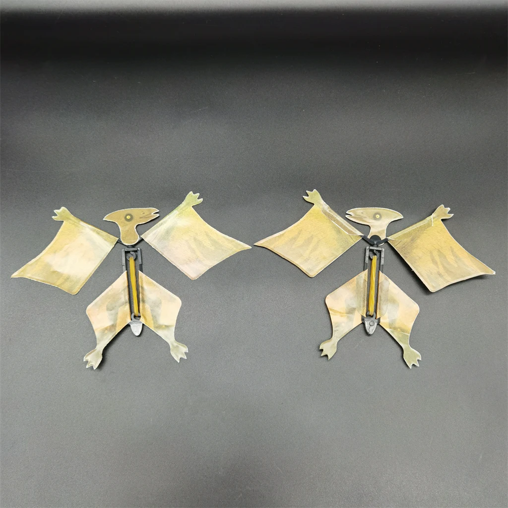 Wind up magic rubber band paper flying dinosaur toy