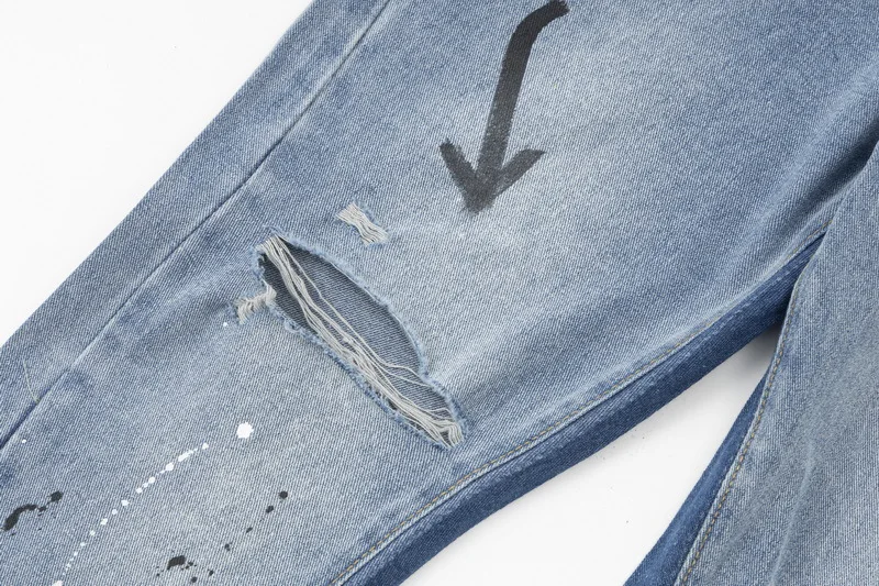 Populaire highstreet-designerjeans met wijde pijpen en inktprint voor mannen en vrouwen, modieus hip-hopstijl, loszittende rechte broek van denim