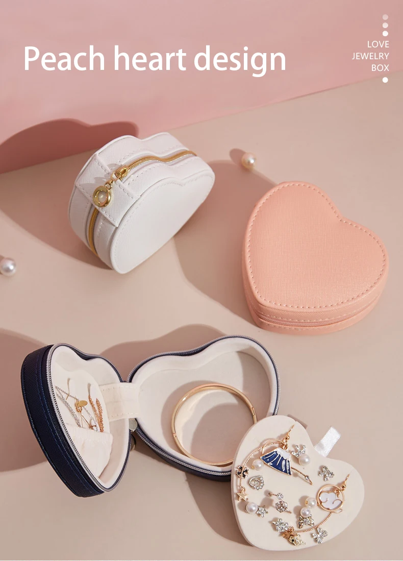 Compact travel-friendly jewelry box Portable heart jewelry case in travel setting