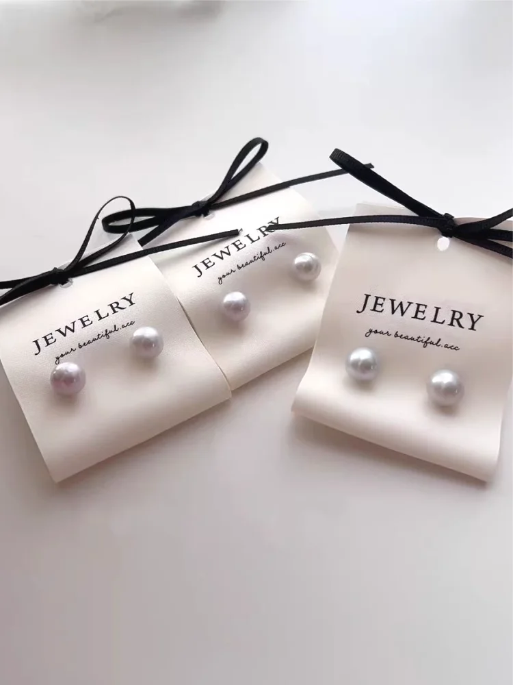 Gold and silver hot-stamping on boutique jewelry packaging Precision foil-stamped branding on earring display cards