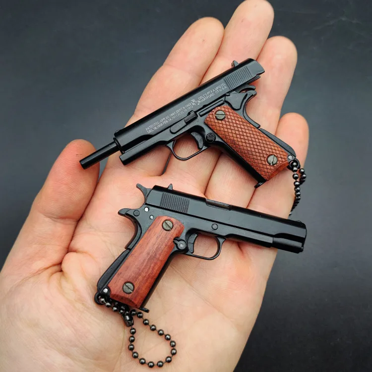 1911 Mini pistola tattica portachiavi portachiavi 1: 3 in metallo a forma  di pistola portachiavi con parti mobili Realistico pistola modello di  pistola collezione ciondolo Charm per uomo Army Fan Gift : : Moda