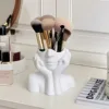 White pen holder for supporting the face