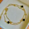 Bracciale in oro a doppio strato con trifoglio nero