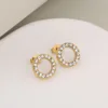 Gold and white rhinestone earrings