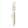 Tenedor de mesa dorado champán