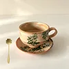 Late light-cup and saucer [with spoon]]