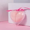 Una concha, dos huevos, cinta, bolso opp, colores mezclados