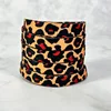 Marrón rojizo con puntos negros Estampado de leopardo rojo