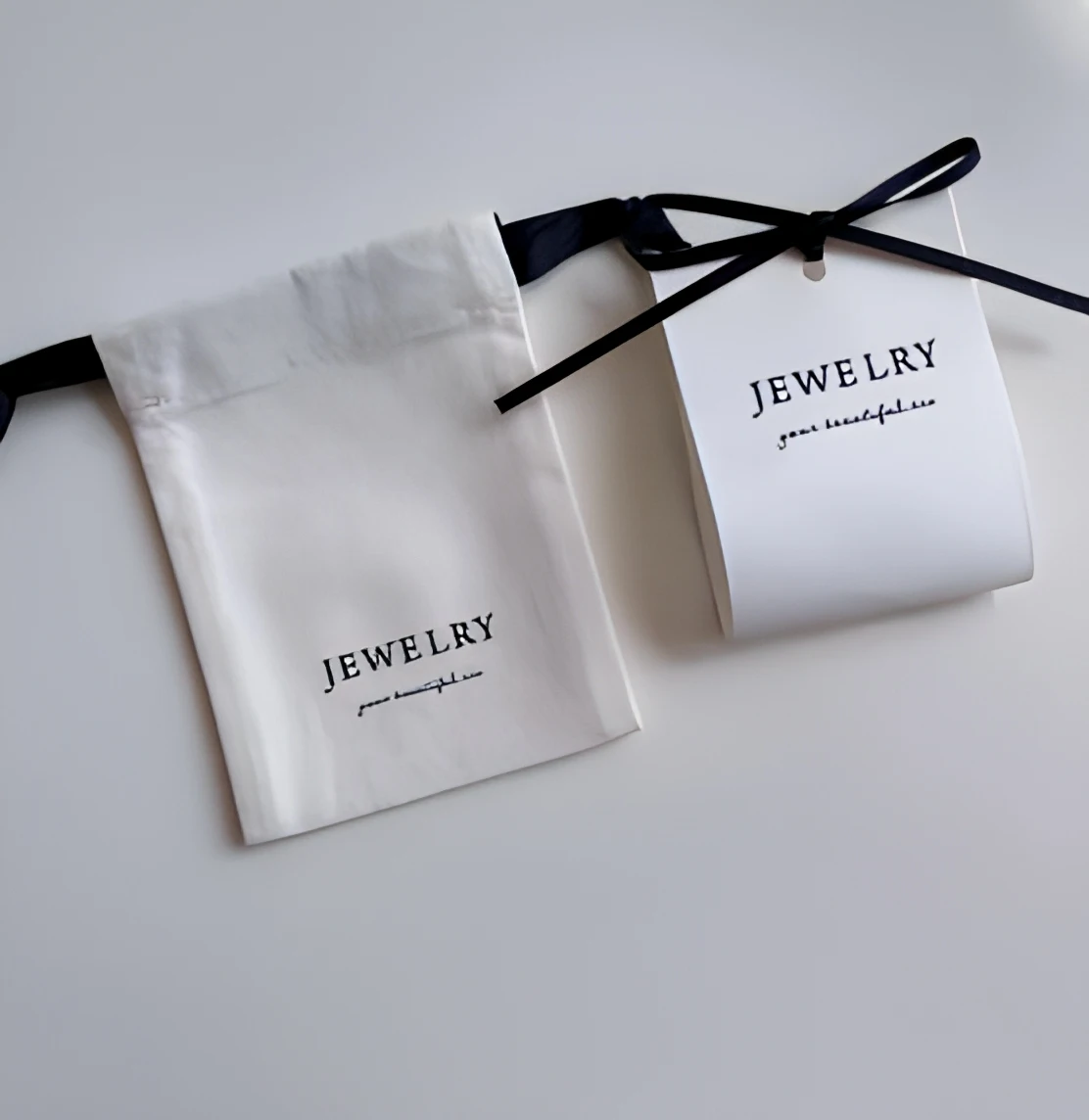 Niche-aesthetic visual rhythm in custom logo packaging Minimalist aesthetic of specialty paper jewelry cards