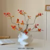 Irregular ceramic vase with 3 autumn leaves