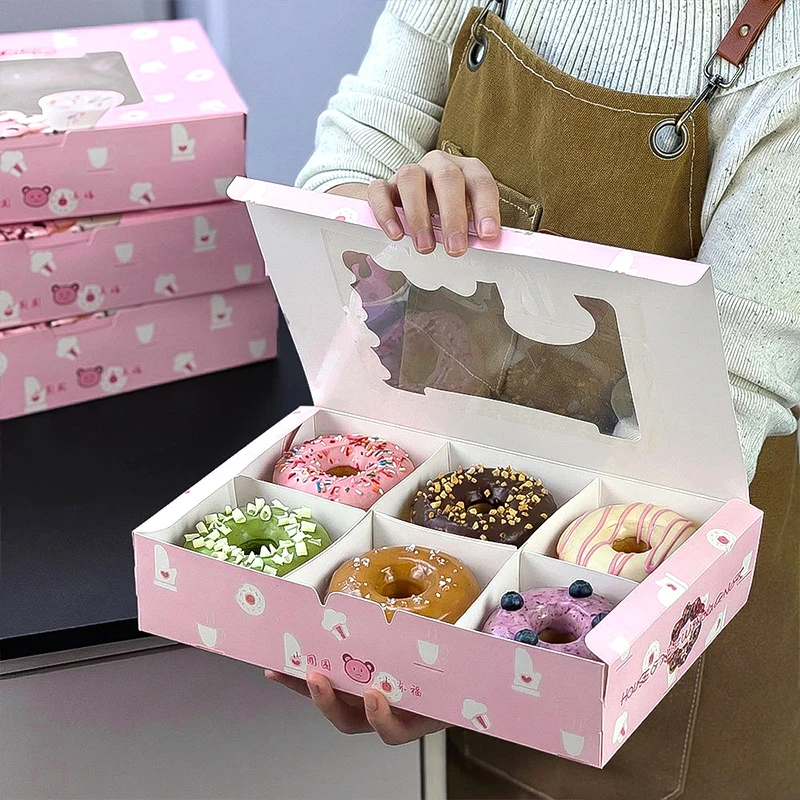 Donutlåda med anpassat logotyp i rosa färg, fönster och indelningar