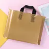 Gold with black handle