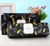 Sac plume noir avec boîte