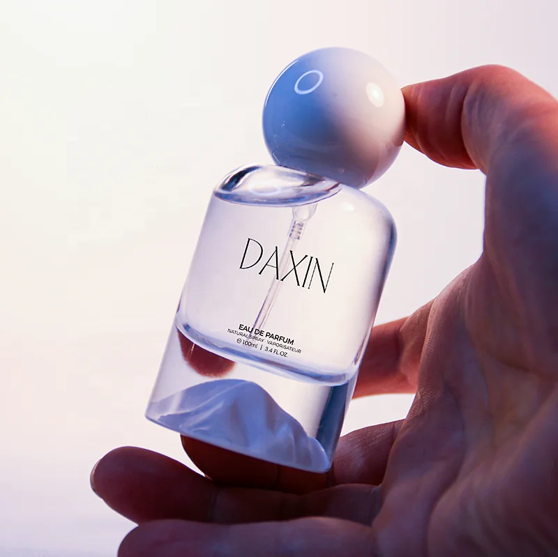 OEM/ODM 30ml 50ml 100ml Cylinder Glass Perfume Bottles with Gold Silver Blue Red Green Bottom for Gift Fragrance