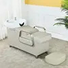 gray-white bed, white porcelain basin