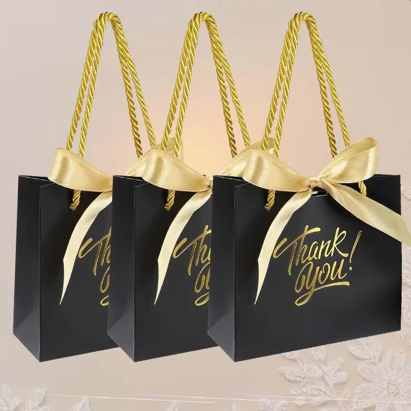 White gift bag with metallic gold embossing and handle