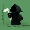 Black-handled grim reaper scythe