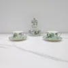 1 teapot, 2 cups, 2 plates