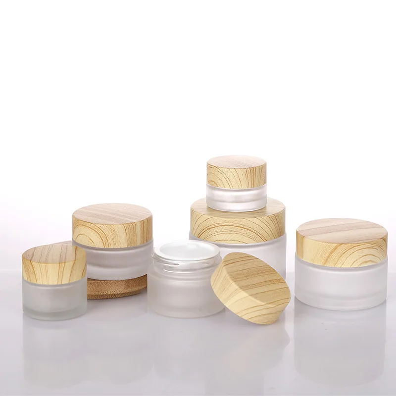 Wholesale round Cosmetic Glass Cream Bottle with Wood Grain Cap for Ointment Storage