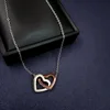 doble corazón de oro rosa