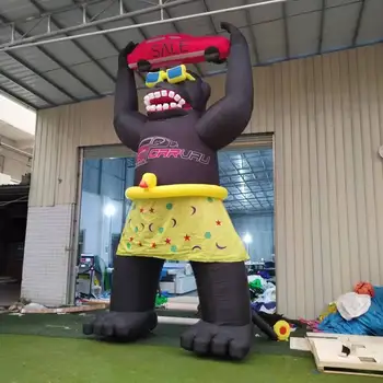 Customized advertising inflatable gorilla holding car outdoor giant inflatable gorilla model for sale