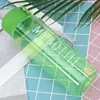 Green bottle with round cap