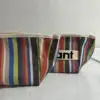 Pajita a rayas de color oscuro (bolsa de cosméticos)