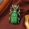 colorful Egyptian scarab brooch in green