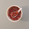 Agua de azúcar con gachas de frijol rojo.