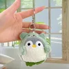 Pingüino travesti verde + hebilla plateada