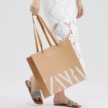 Creative Custom Logo Luxury Printed Shopping Bags Brown Kraft Paper Bags Printed Shop Apparel Packing Bags with Your Own Logo